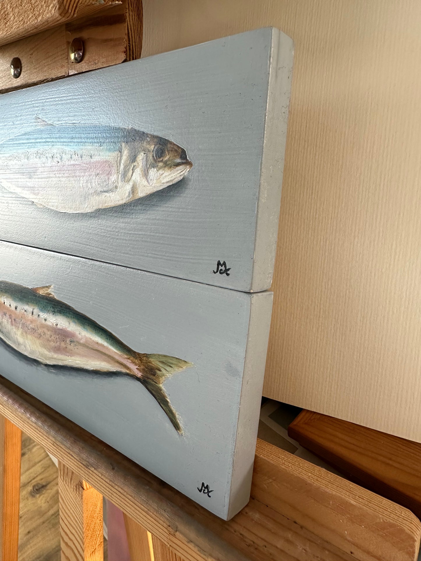 Original oil paintings of two mackerel on a blue background by Cotswold artist Susan McCraith